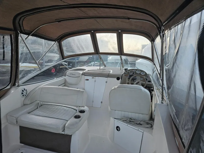 Slide: The Image of 2001 Bayliner 2655 Cierra boat interior with seating and steering wheel. - 8