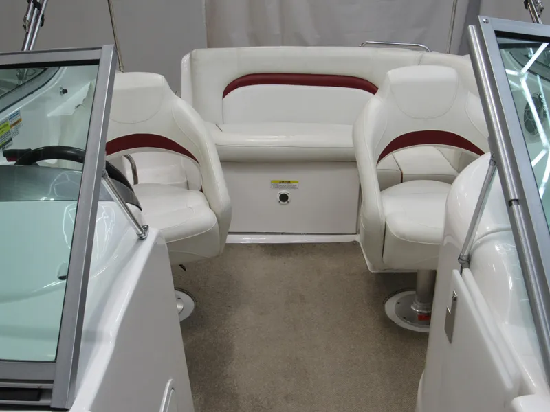 Slide: The Image of 2014 Hurricane SunDeck 2200 IO interior with white and red seating arrangement. - 4