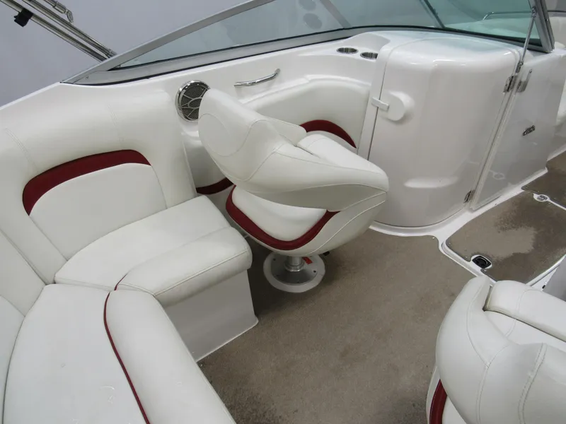 Slide: The Image of 2014 Hurricane SunDeck 2200 IO boat interior with white and red seating. - 6