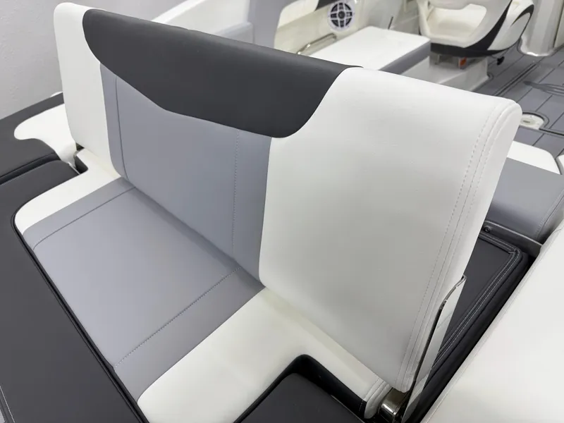 Slide: The Image of 2025 Chaparral 23 SSi boat interior with modern, sleek seating design. - 11