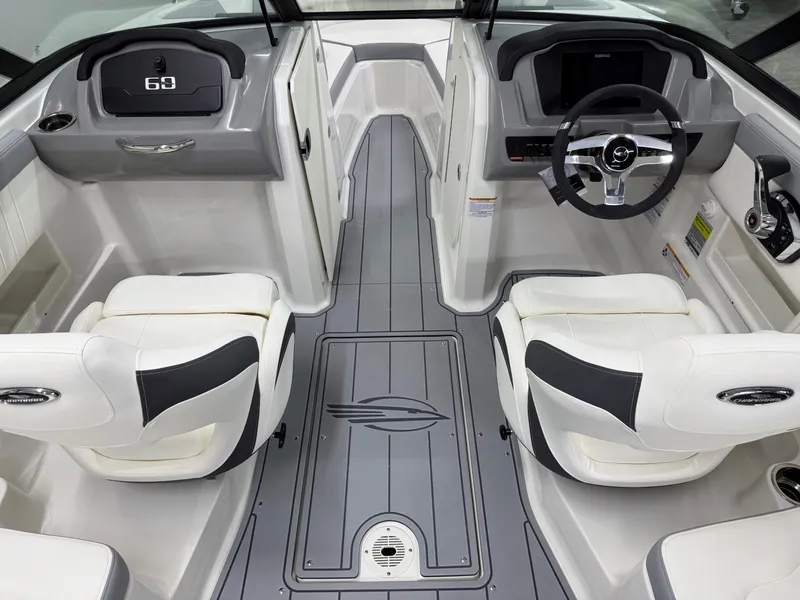 Slide: The Image of 2025 Chaparral 23 SSi boat interior with modern dashboard and seating. - 13