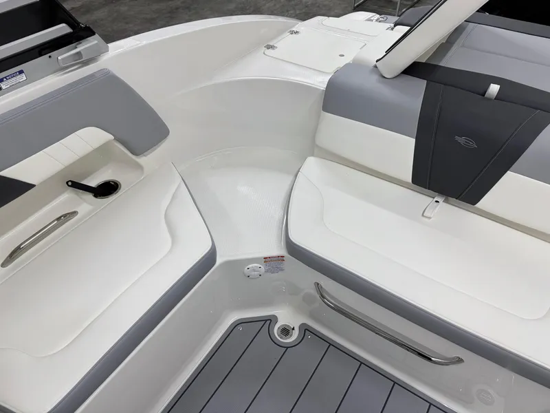 Slide: The Image of 2025 Chaparral 23 SSi boat interior with sleek seating and modern design. - 21