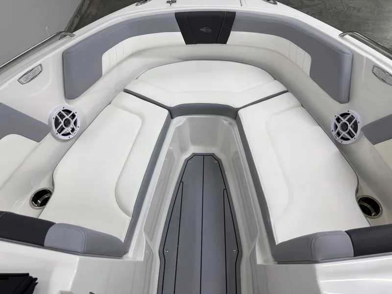 Slide: The Image of 2025 Chaparral 23 SSi boat interior with white and gray seating, modern design. - 29