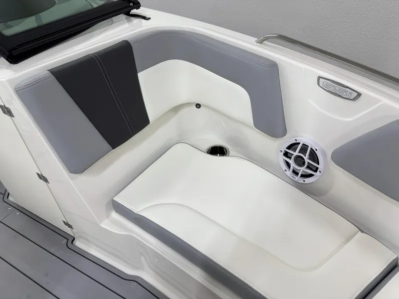 Slide: The Image of 2025 Chaparral 23 SSi boat interior with gray and white seating and speaker. - 30