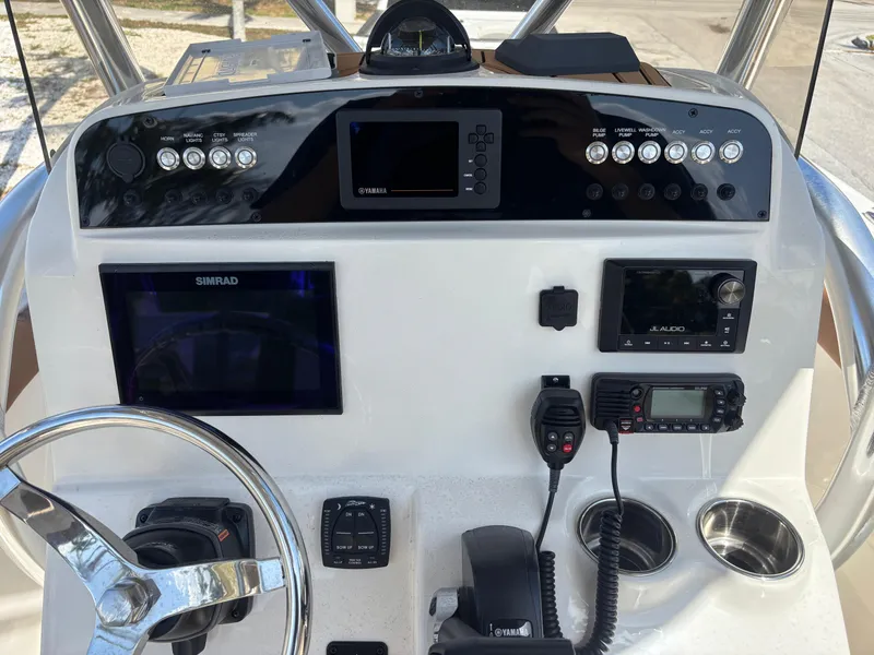Slide: The Image of 2025 Pioneer 202 Sportfish dashboard with advanced navigation and communication systems. - 9