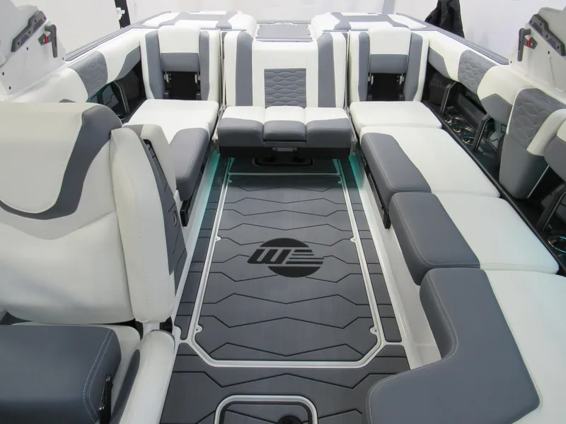 Slide: The Image of 2025 Malibu Wakesetter 24 MXZ interior with luxurious seating and modern design. - 10