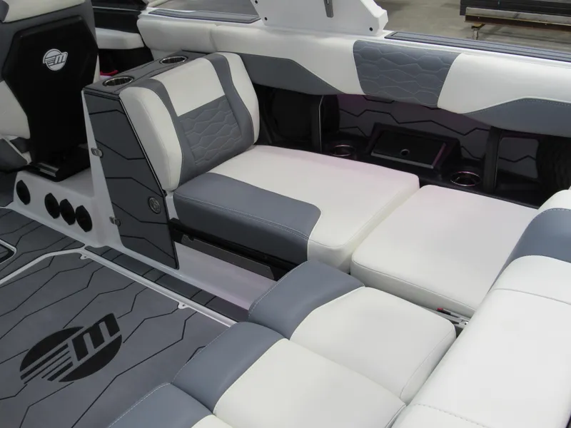 Slide: The Image of 2025 Malibu Wakesetter 24 MXZ interior with gray and white seating, modern design. - 5