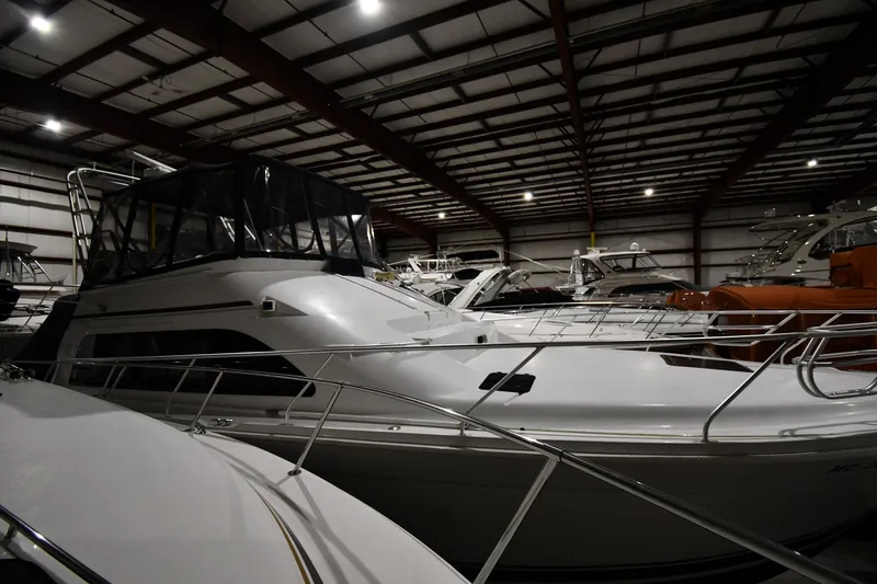Slide: The Image of 1997 Mainship 40 Sedan Bridge yacht in indoor storage facility. - 0