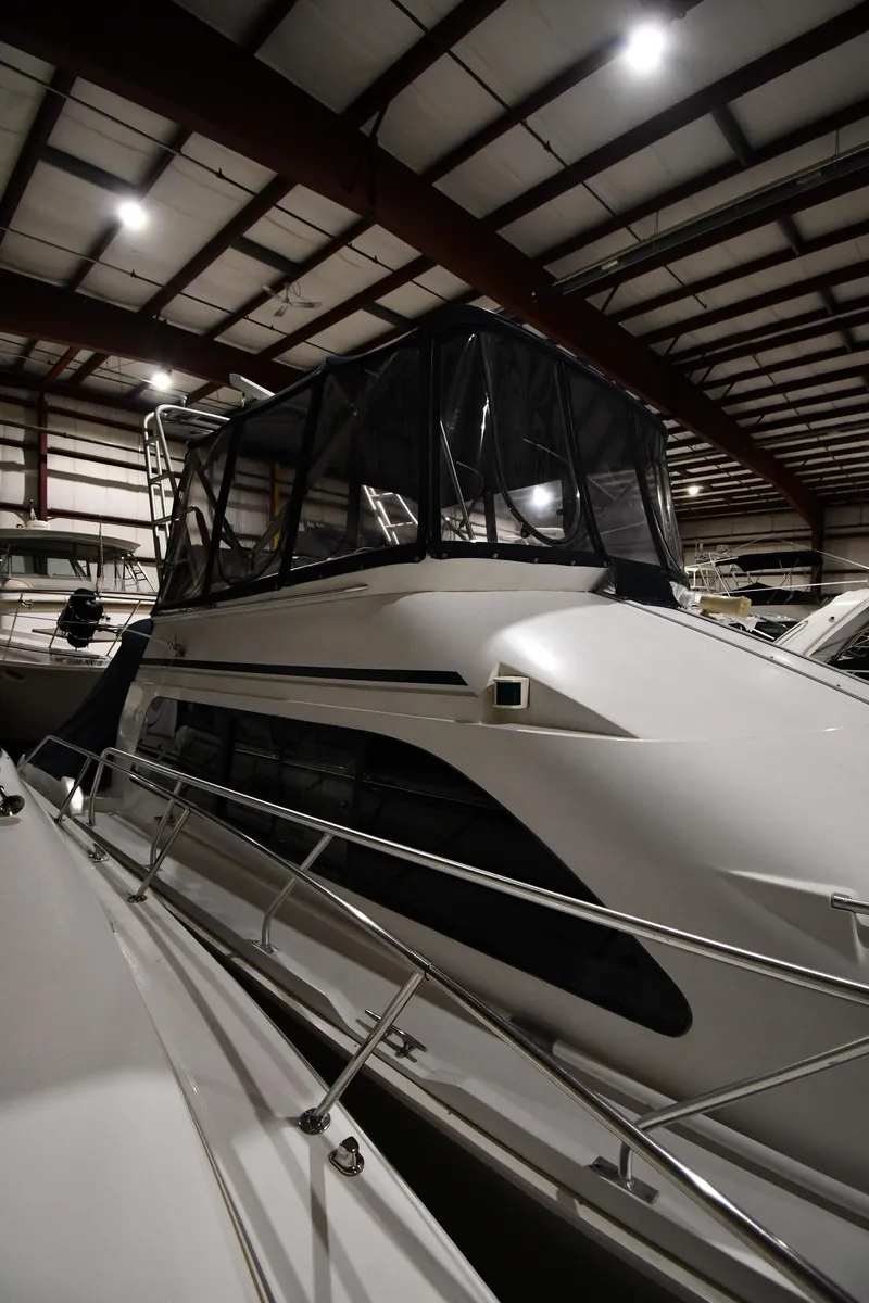 Slide: The Image of 1997 Mainship 40 Sedan Bridge yacht in indoor storage facility. - 1