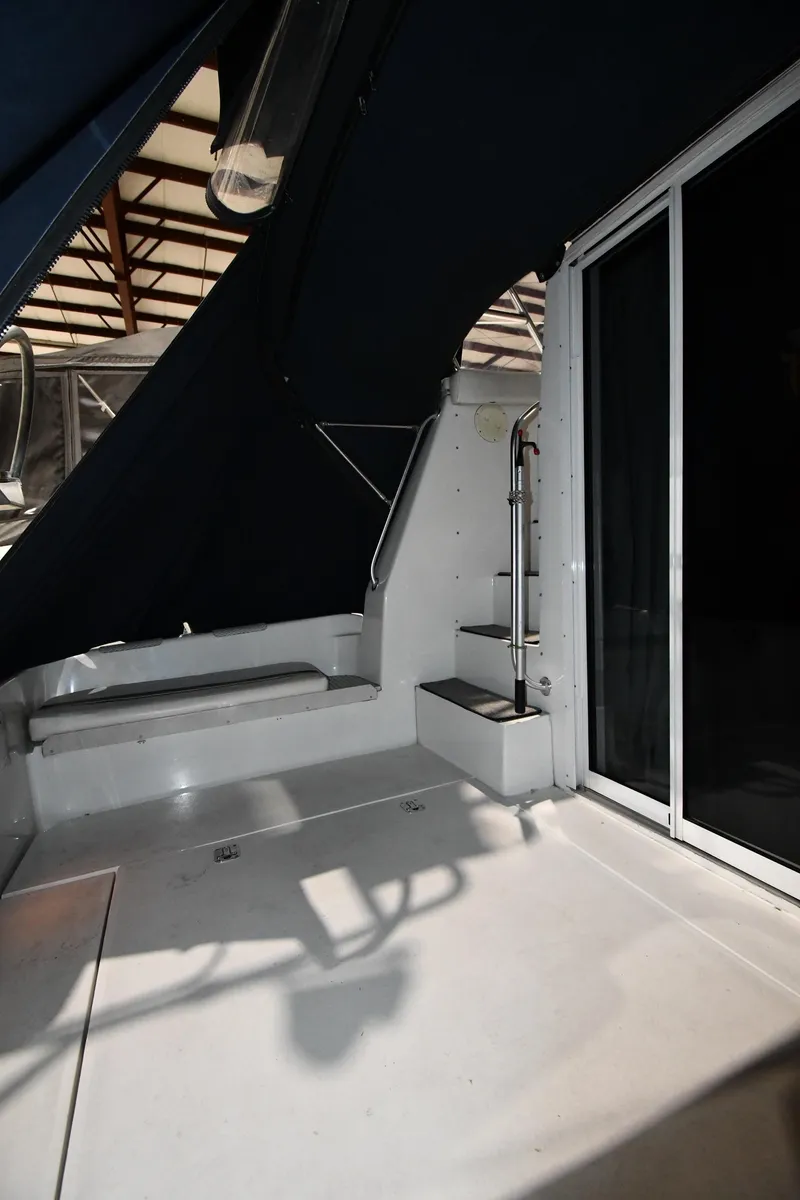 Slide: The Image of 1997 Mainship 40 Sedan Bridge interior with stairs and sliding door. - 10