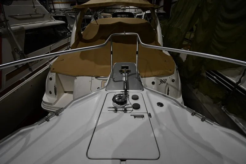 Slide: The Image of 1997 Mainship 40 Sedan Bridge boat in storage, featuring deck and railing. - 3