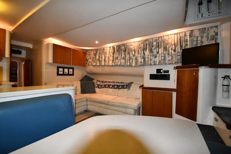 Slide: The Image of Interior of 1997 Mainship 40 Sedan Bridge with cozy seating and modern amenities. - 35