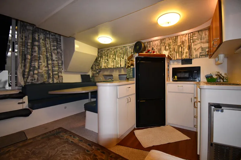 Slide: The Image of Interior of 1997 Mainship 40 Sedan Bridge with kitchen and seating area. - 39