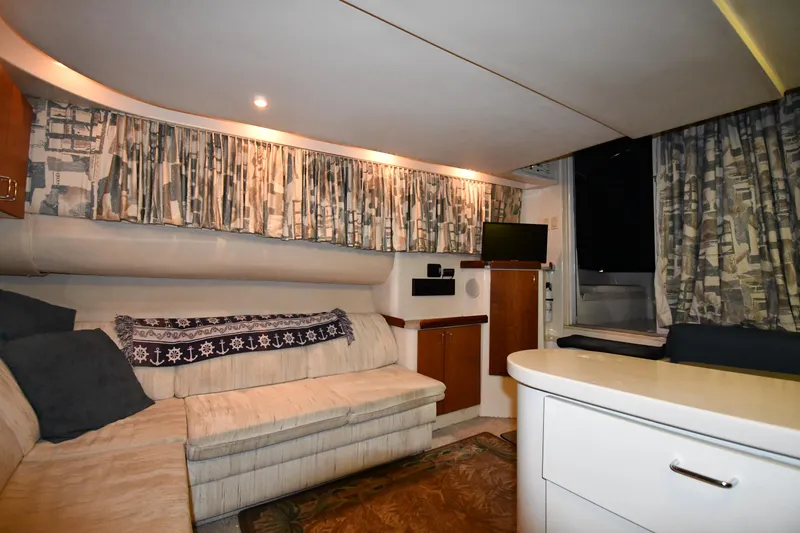 Slide: The Image of Interior of 1997 Mainship 40 Sedan Bridge with cozy seating and modern amenities. - 40