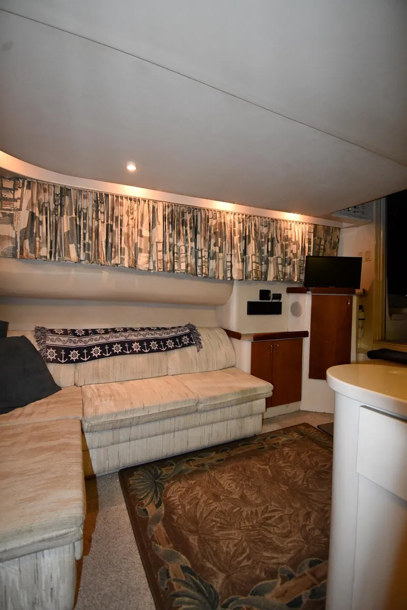 Slide: The Image of 1997 Mainship 40 Sedan Bridge interior with cozy seating and modern amenities. - 41