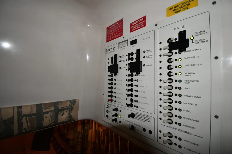 Slide: The Image of Electrical control panel on a 1997 Mainship 40 Sedan Bridge boat. - 47