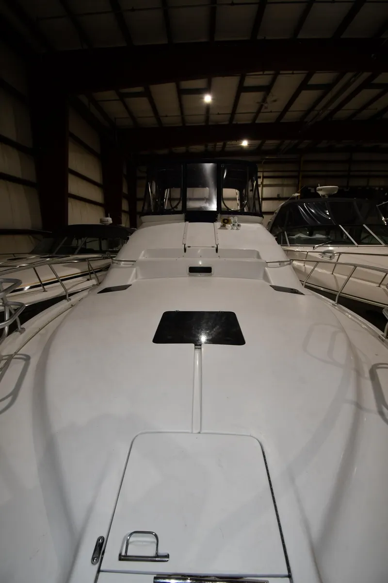 Slide: The Image of 1997 Mainship 40 Sedan Bridge yacht in indoor storage facility. - 5