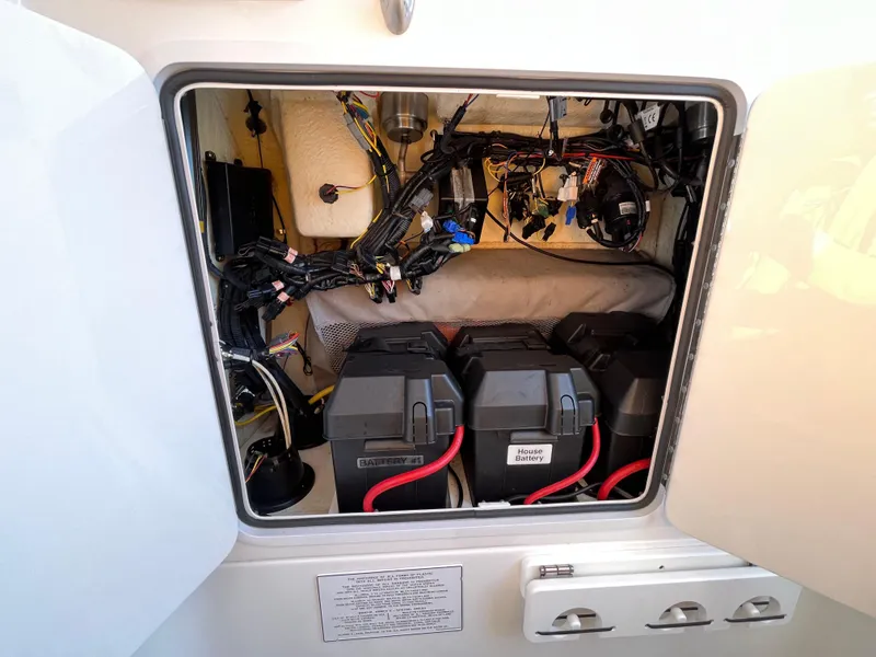 Slide: The Image of 2018 Regulator 31 boat battery compartment with wiring and components. - 24