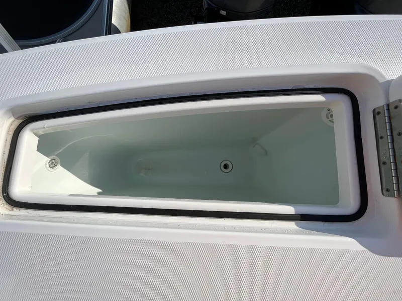 Slide: The Image of Open storage compartment on a 2018 Regulator 31 boat, showcasing interior space. - 27