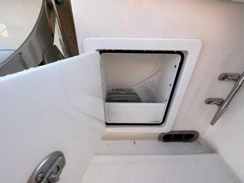 Slide: The Image of Open storage compartment on a 2018 Regulator 31 boat. - 29