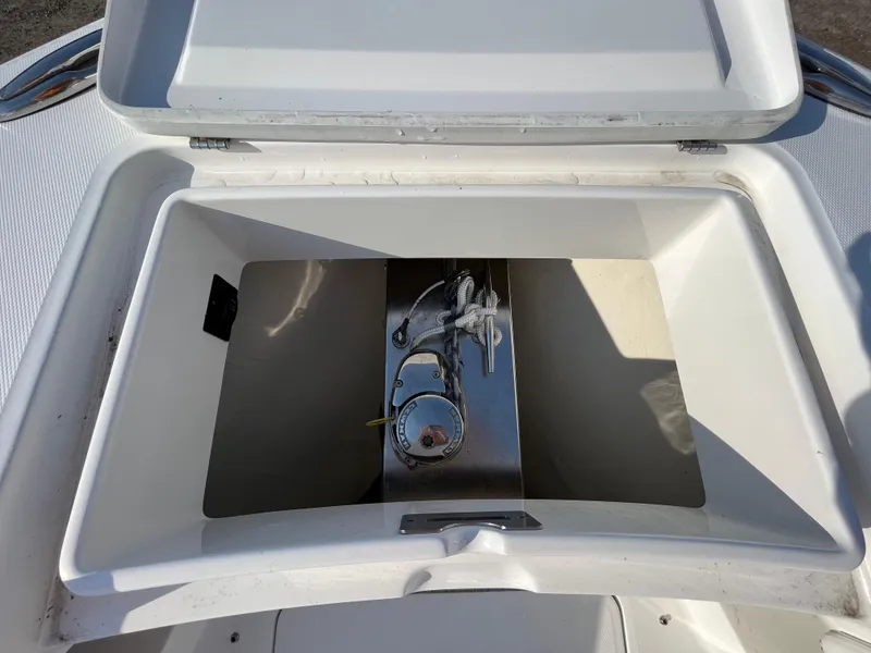 Slide: The Image of Open storage compartment on 2018 Regulator 31 boat, featuring a sleek stainless steel interior. - 36