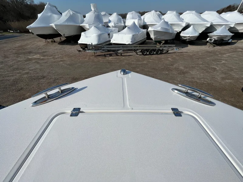 Slide: The Image of Bow of 2018 Regulator 31 boat with covered boats in background. - 37