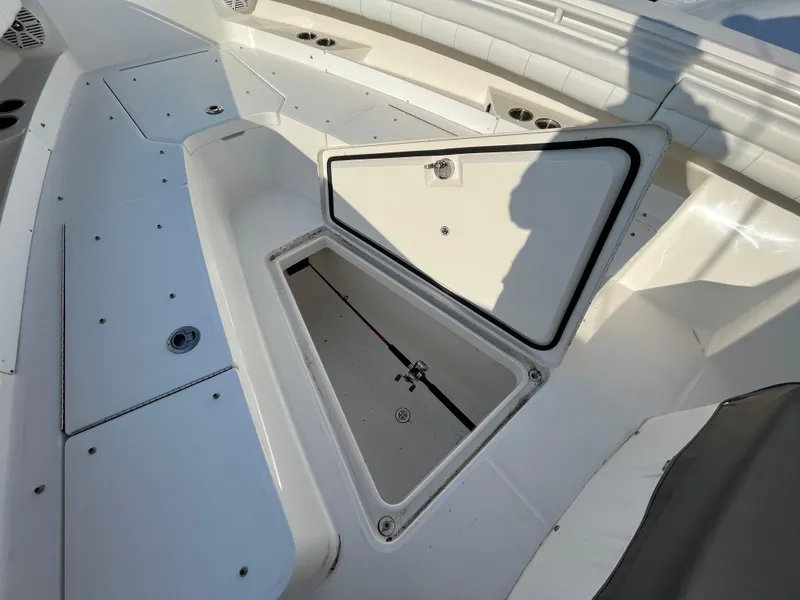 Slide: The Image of 2018 Regulator 31 boat with open storage compartment on deck. - 40