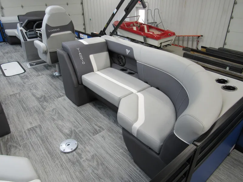 Slide: The Image of Luxurious 2025 Viaggio X24U boat interior with sleek gray seating and modern design. - 11