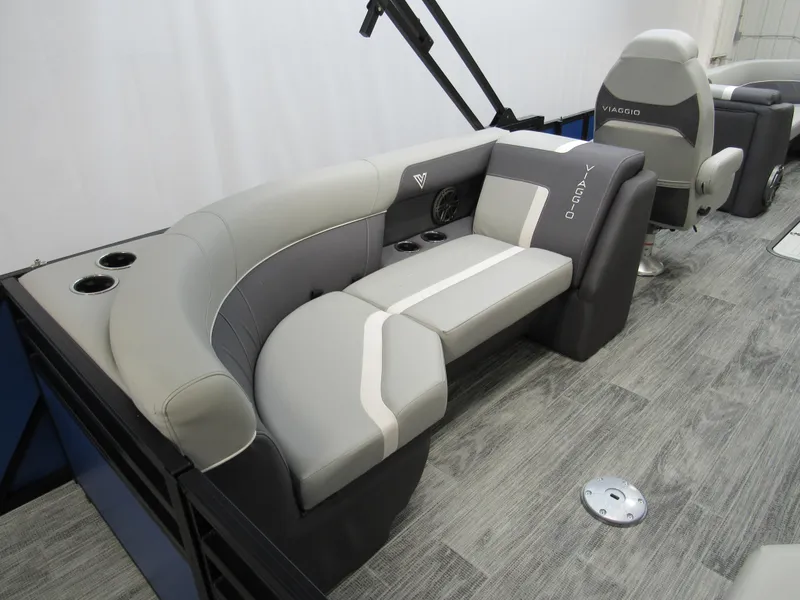 Slide: The Image of Luxurious Viaggio X24U 2025 boat seating with gray upholstery and cup holders. - 12