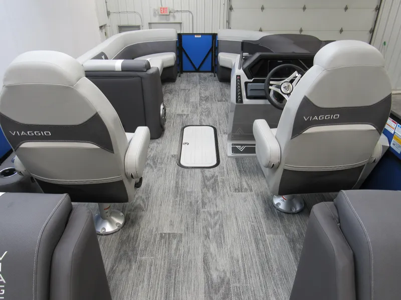 Slide: The Image of Interior of 2025 Viaggio X24U boat with modern seating and steering console. - 4