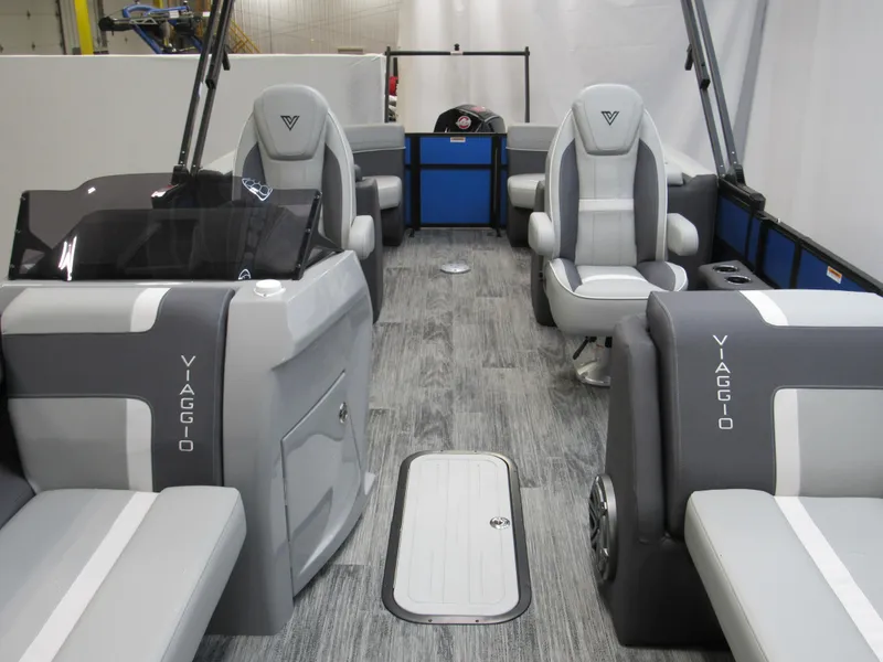 Slide: The Image of 2025 Viaggio X24U boat interior with gray seating, modern design, and spacious layout. - 8