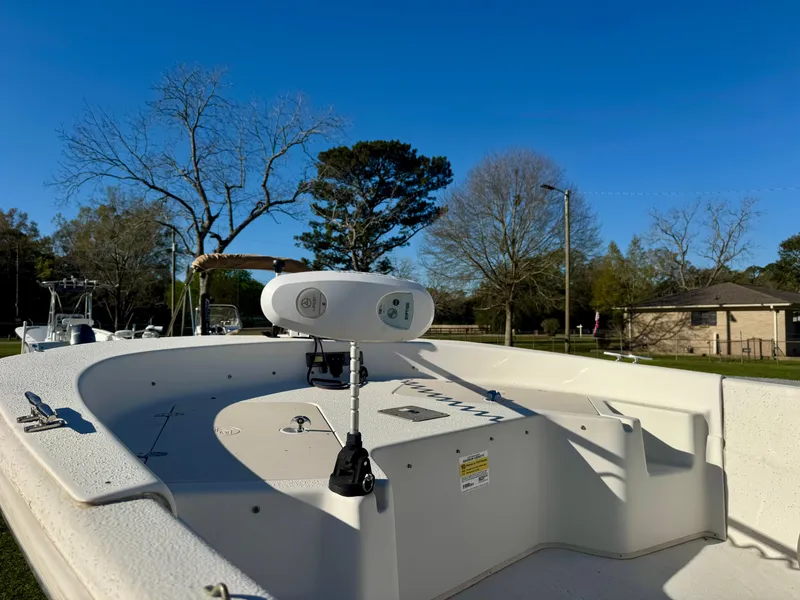 Slide: The Image of 2014 Carolina Skiff 198 DLV boat deck under clear blue sky. - 6