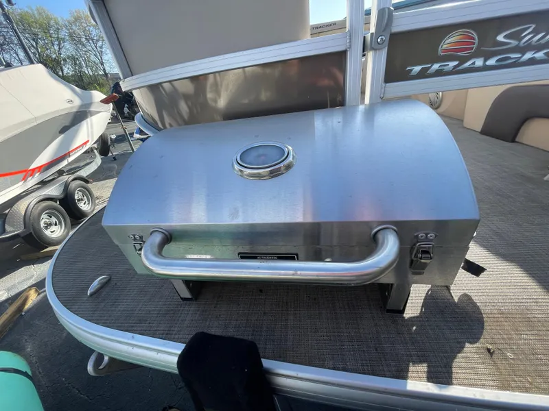 Slide: The Image of Stainless steel grill on 2019 Sun Tracker SportFish 22 DLX pontoon boat deck. - 27