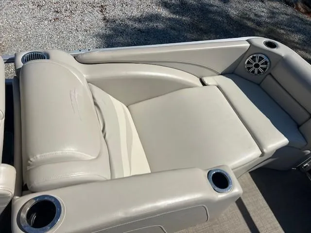 Slide: The Image of 2015 Bennington 2574 GCW boat seating with cup holders and speaker. - 13