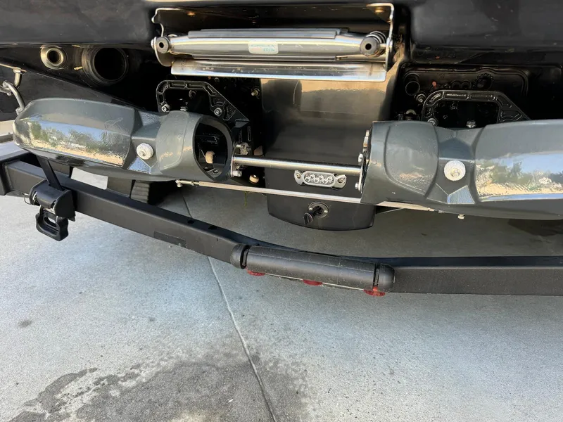 Slide: The Image of Rear view of 2021 Scarab 215 ID boat with dual exhaust and jet propulsion system. - 12