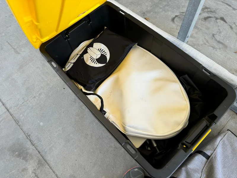 Slide: The Image of Open storage box with boat cover for 2021 Scarab 215 ID. - 17