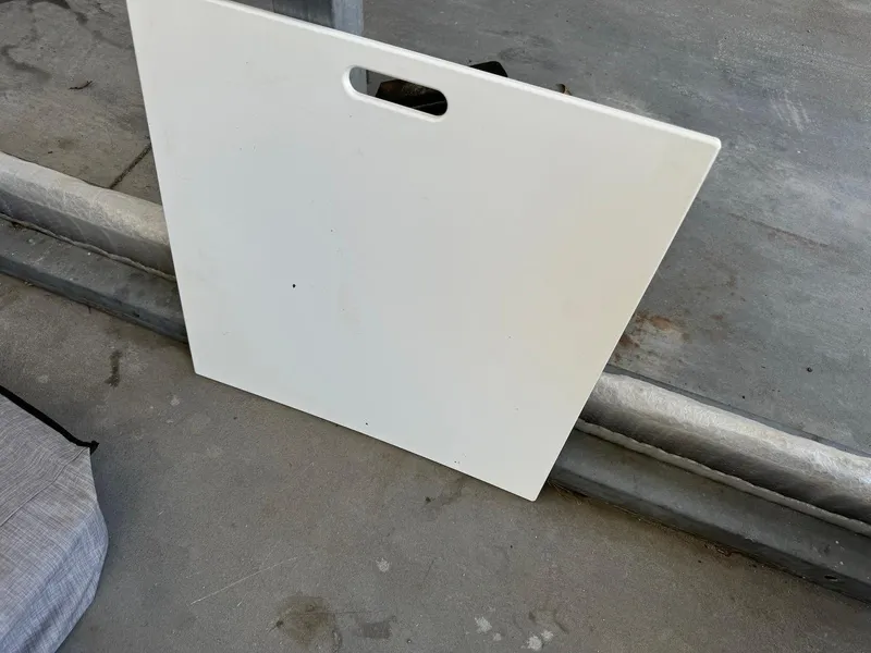 Slide: The Image of White panel with handle on concrete surface, Scarab 215 ID 2021 model. - 18