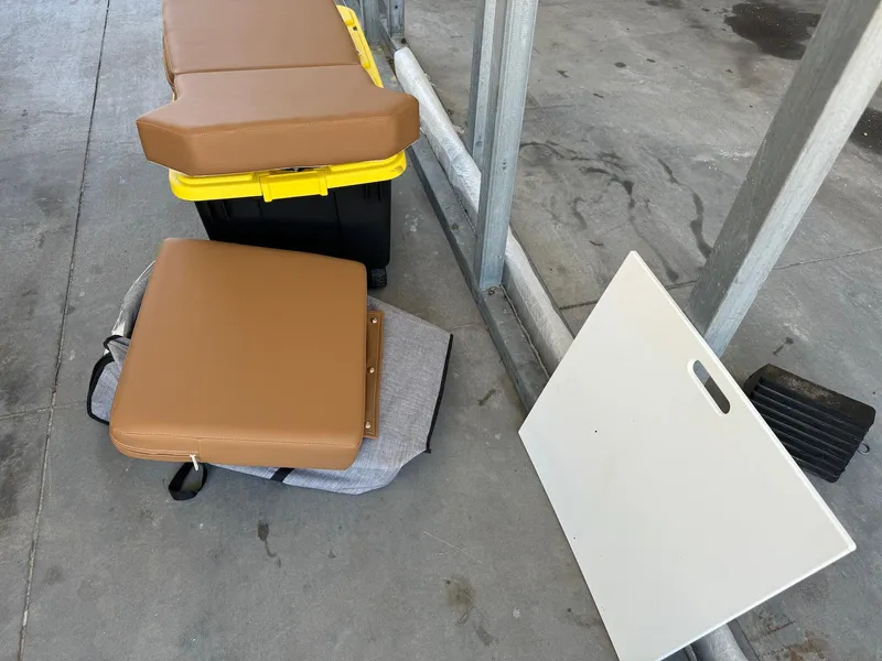 Slide: The Image of Cushions and panel from 2021 Scarab 215 ID boat on concrete floor. - 21