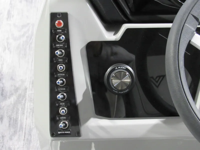 Slide: The Image of Control panel of 2025 Viaggio Z22Q boat with audio system and switches. - 12