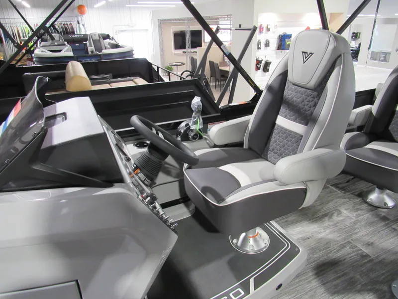 Slide: The Image of 2025 Viaggio Z22Q boat interior with modern helm and comfortable captain's chair. - 8