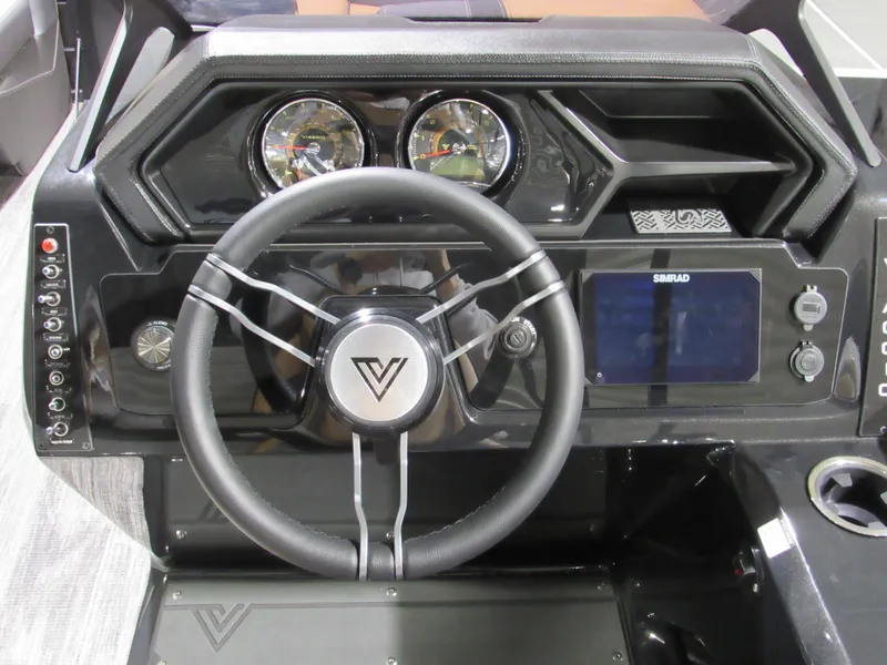 Slide: The Image of Steering wheel and dashboard of 2025 Viaggio Z22S boat with modern controls and display. - 12