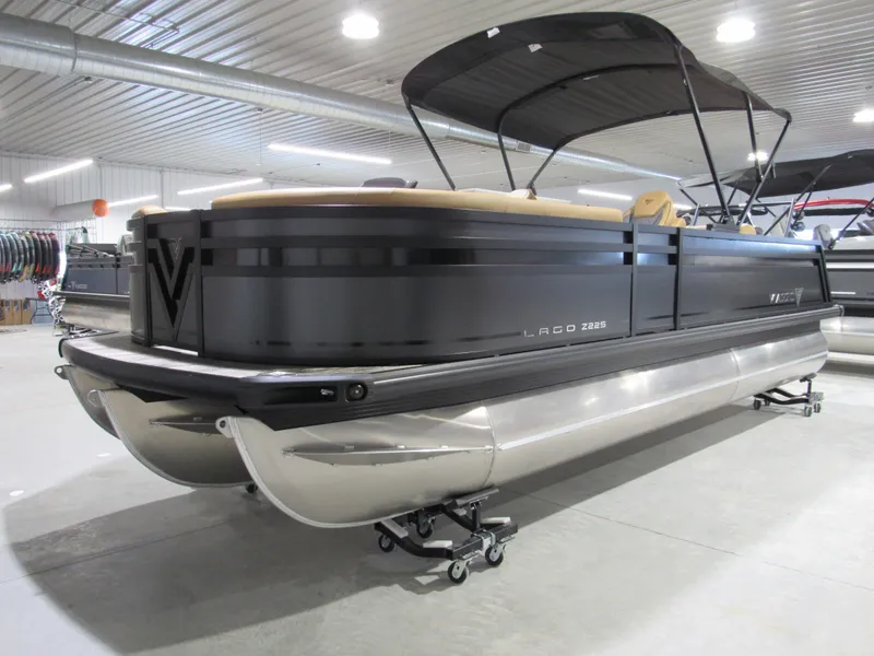 Slide: The Image of 2025 Viaggio Z22S pontoon boat in showroom, featuring sleek design and modern amenities. - 2