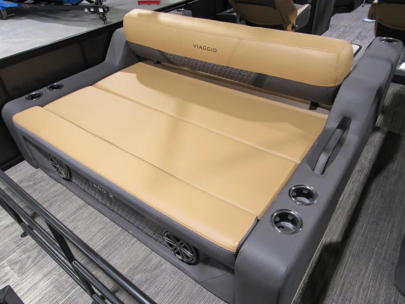 Slide: The Image of 2025 Viaggio Z22S boat seat with tan upholstery and integrated cup holders. - 5