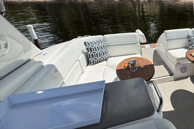 Slide: The Image of Luxurious 2011 Regal 3350 Cuddy boat interior with white seating and stylish decor. - 26