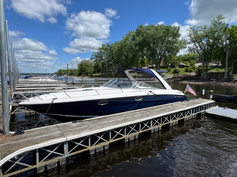 Slide: The Image of 2011 Regal 3350 Cuddy boat docked on a sunny day with blue skies. - 4