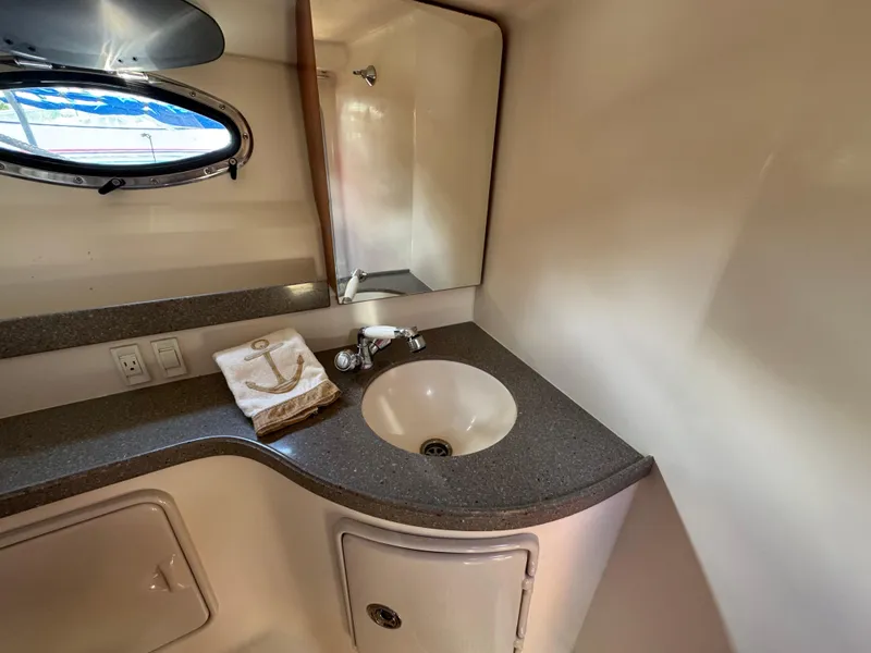 Slide: The Image of 2011 Regal 3350 Cuddy bathroom with sink, mirror, and countertop. - 45