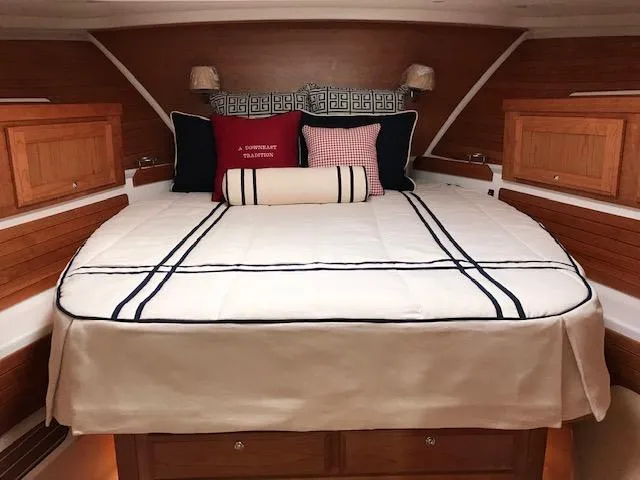 Slide: The Image of Luxurious cabin interior of 2026 Back Cove 372 yacht with elegant bedding and wooden accents. - 10