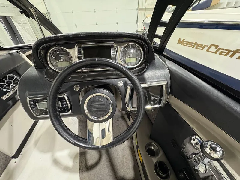 Slide: The Image of 2011 Malibu Wakesetter 21 VLX dashboard with steering wheel and control panel. - 10