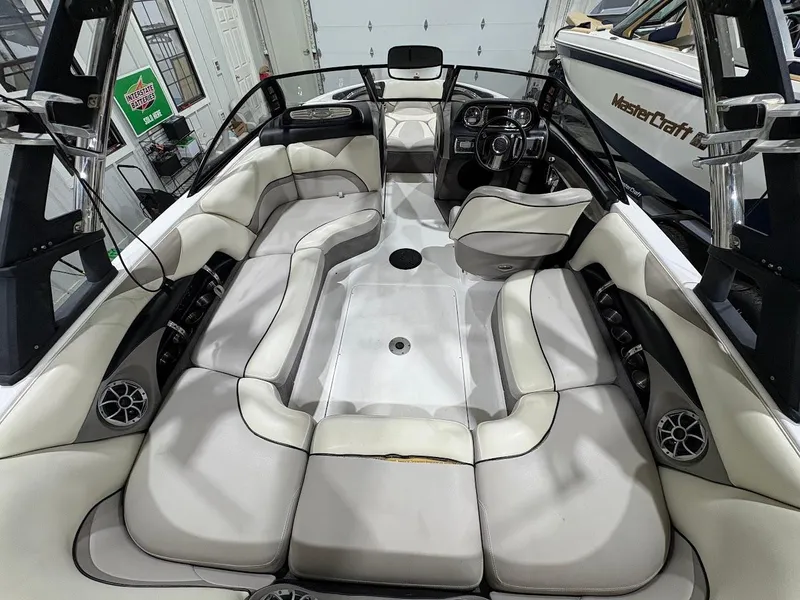 Slide: The Image of 2011 Malibu Wakesetter 21 VLX interior with spacious seating and modern dashboard. - 14