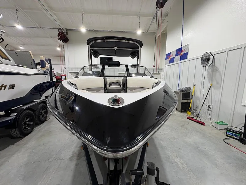 Slide: The Image of 2011 Malibu Wakesetter 21 VLX boat in indoor storage, front view. - 6